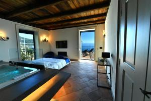 Кровать или кровати в номере In Costa Relais & Luxury Suites