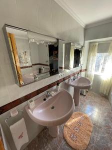 a bathroom with a sink and a mirror at Casa da Torre 