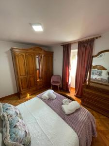 a bedroom with a bed with two towels on it at Casa da Torre 