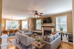 a living room with a couch and a fireplace at Perfect Pinehurst Getaway- Walkable to the Village in Pinehurst