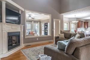 a living room with a couch and a fireplace at Sleeps 8- in Carthage in Carthage