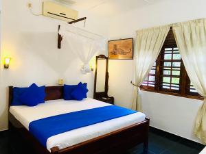 Rúm í herbergi á Mali Guest House