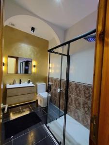 a bathroom with a shower and a sink at Tal-Munfuha- Centrally Located Space. in Valletta