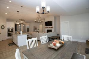 a kitchen and living room with a table with fruit on it at Sleeps 8- on Highway 5 in Aberdeen
