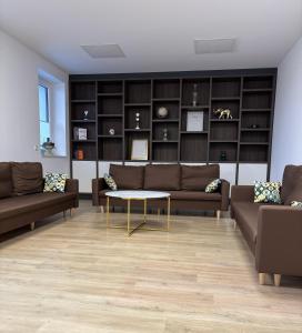a living room with two couches and a table at wobStay family & fitters in Worbis