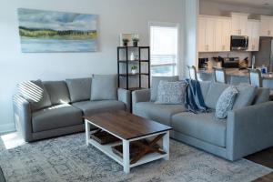 a living room with two couches and a coffee table at Sleeps 9- In Whispering Pines in Carthage