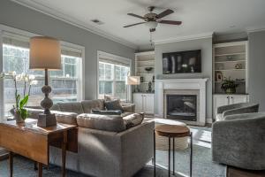 a living room with a couch and a fireplace at Sleeps 8- In Whispering Pines 