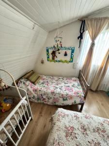 A bed or beds in a room at Hostal LuDav - Temuco