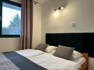 Posteľ alebo postele v izbe v ubytovaní Avila Park & SPA
