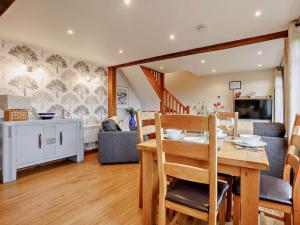 a dining room and living room with a table and chairs at 2 Bed in Launceston BRDEX in Launceston