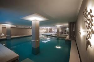 a large swimming pool in a large room with at Hotel Slatina in Rogaška Slatina