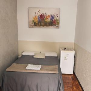 Кровать или кровати в номере FLÓRIDA POUSADA