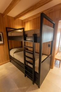 a bunk bed room with two bunk beds in it at Explora la magia de San Martín de los Andes in San Martín de los Andes