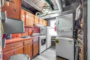 an rv kitchen with a stove and a refrigerator at Easy Interstate Access Original Poconos Log Cabin in Blakeslee +23 photos