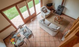 an overhead view of a living room with a table at Bio Quinta do Pantano, Agro Turismo in Santo da Serra