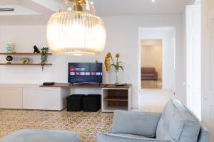 A television and/or entertainment centre at Florette Suite Designer Finish in Floriana