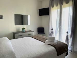 En eller flere senge i et værelse på Italia - zona centrale - Narramondo Villas
