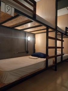 a bedroom with a bunk bed with a ladder at L2 Bacalar in Bacalar