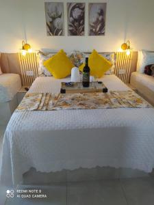 Кровать или кровати в номере Pousada Sitio Pauletto Chales e Casas com cozinha