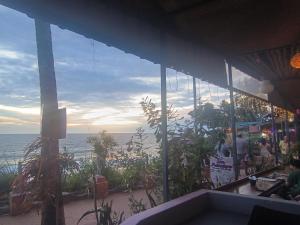 a view of the ocean from a restaurant at Mad about Coco Yoga & Beach Retreat in Varkala