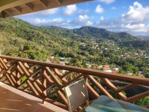 a balcony with a view of a mountain at Nia's Hillside Loft - Exquisite Views in Gros Islet