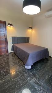 - une chambre avec un lit dans l'établissement Pousada La Bella Italia, à Aquiraz