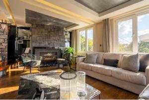 a living room with a couch and a fireplace at Ortaköy Luxury Villa with Bosborus View in Istanbul