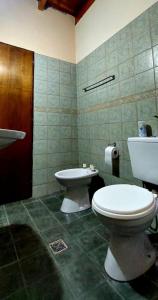 a bathroom with a toilet and a bidet at DEPARTAMENTO COMPLETO 4 Pers Mza in Las Heras