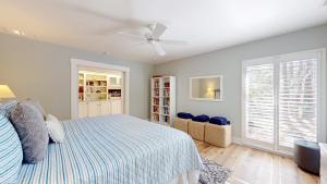 a bedroom with a bed and a ceiling fan at 79 Port Tack in Hilton Head Island +28 photos