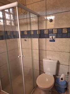a bathroom with a toilet and a shower at Hostel My House quartos perto do aeroporto de Guarulhos in Guarulhos