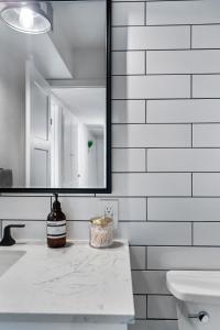 a bathroom with a sink and a mirror at Tempe Modern Farmhouse in Tempe