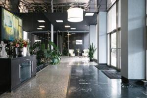 an office with a hallway with potted plants in it at Downtown ATL Condo Walk Score 78 w Free Parking LM1104 in Atlanta