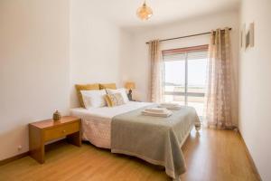 Ένα ή περισσότερα κρεβάτια σε δωμάτιο στο Sea View - Charming apartment
