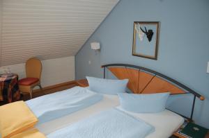 Postel nebo postele na pokoji v ubytování Hotel Leander