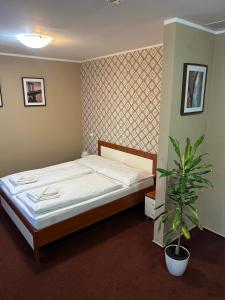 Postel nebo postele na pokoji v ubytování Hotel 21