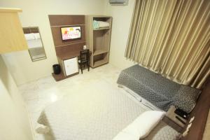 TV a/nebo společenská místnost v ubytování Hotel Real