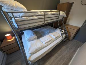 a couple of bunk beds in a room at Station Apartments in Ashton in Makerfield