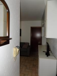 a small kitchen with a couch in a room at Marco Romani in Perugia