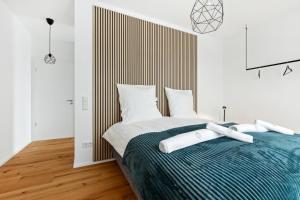Ένα ή περισσότερα κρεβάτια σε δωμάτιο στο PEAKview: Penthouse / Zentrum / Netflix +12 φωτογραφίες