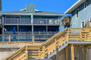 a house with a wooden ramp in front of a house at Ponce Inlet Villa in Ponce Inlet