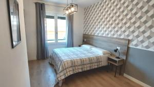 A bed or beds in a room at AnGiò holiday rooms