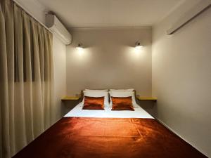 Ein Bett oder Betten in einem Zimmer der Unterkunft Portofino Urla Boutique Hotel