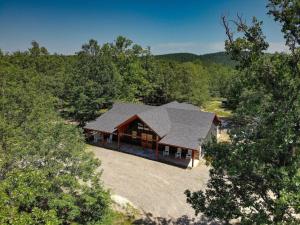 an overhead view of a house in the woods at Deluxe Forest Haven Hot Tub Sleeps 10 in Stephens Gap