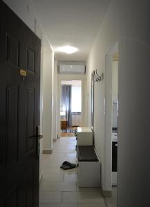 a room with a hallway with a door and a room with at Apartment Ematours in Požega