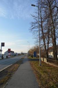 a street light on the side of a road at Apartment Ematours in Požega