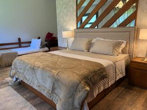 Säng eller sängar i ett rum på Casa Holanda