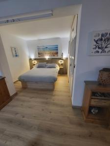 a bedroom with a large bed in a room at Apartamento delfin verde in Benalmádena +23 photos