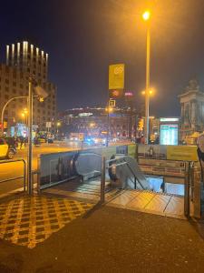 a boardwalk in a city at night at Room Familiar nube paraiso in Barcelona