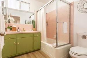 a bathroom with a shower and a toilet and a sink at Mid Century 1BR Apt w Patio Near LAX Playa Vista Beach in Los Angeles