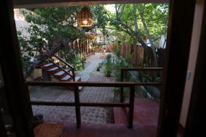 a view of a patio with a table and chairs at Casa AVA in Mazunte